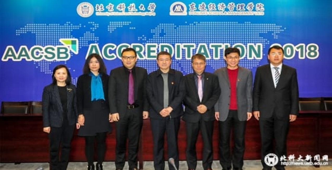 A group of people posing for the camera
Description generated with very high confidence